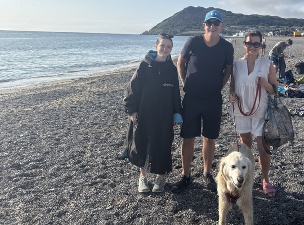 Rachel Kallinin, Susan Mullane, John Mullane and their dog on Bray beach
