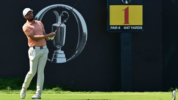 David Howard watches his drive from the 1st tee at 2006 Open Championship