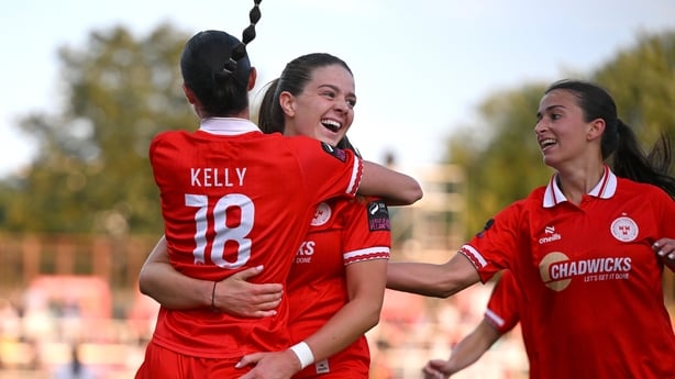 Becky Watkins of Shelbourne, centre, celebrates with teammate Aoife Kelly after scoring her side's first goal during the Women's All-Island Cup final match between Shelbourne and Galway United at Tolka Park in Dublin.