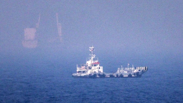ships sailing near the Strait of Hormuz off the eastern coast of the United Arab Emirates at Khor Fakkan
