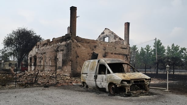 A view of a burned house and vehicle, in Lanton, in the Lege-Cap-Ferret region, southwestern France