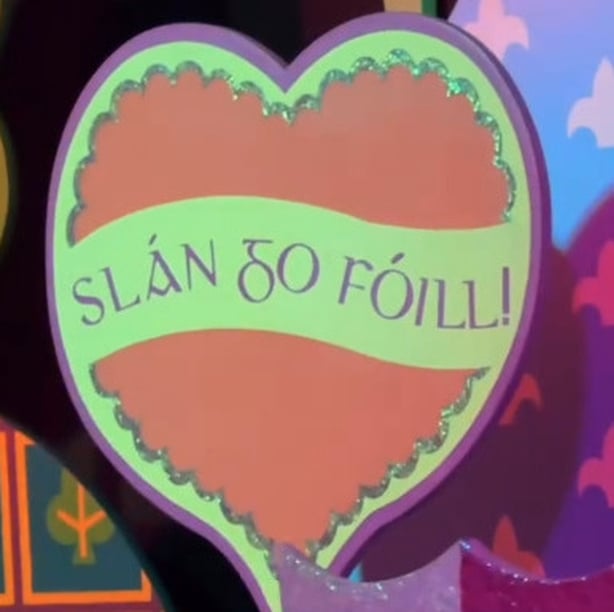 Irish language signs on the It's a Small World ride at Disneyland Paris (@DLPTipsForIrish)