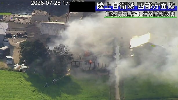 Screengrab handout from Japan's Ministry of Defence of a building with smoke rising from it after an earthquake in Uki City, Kumamoto Prefecture 