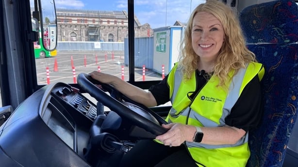 RTE Eastern Correspondent Samantha Libreri sitting in the drivers seat of a Bus