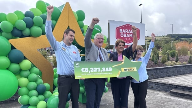 Obama Plaza staff celebrate selling winning lotto ticket 