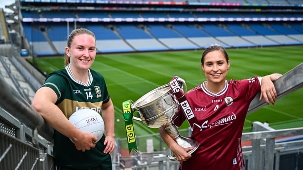 Kerry footballer Síofra O'Shea and Galway footballer Kate Geraghty with The Brendan Martin Cup