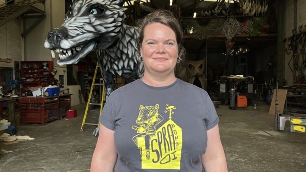 Deirdre Dwyer in front of a parade float.