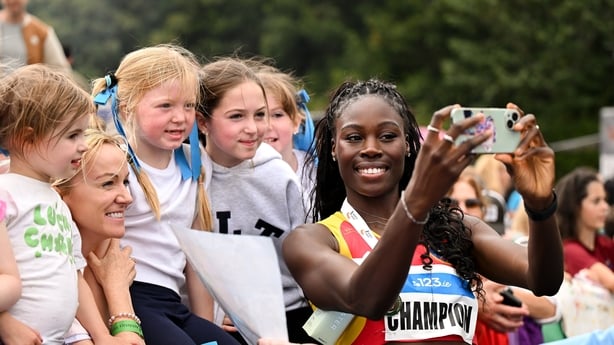 Rhasidat Adeleke signs autographs after her win in the 200m at the 2026 National Senior Championships