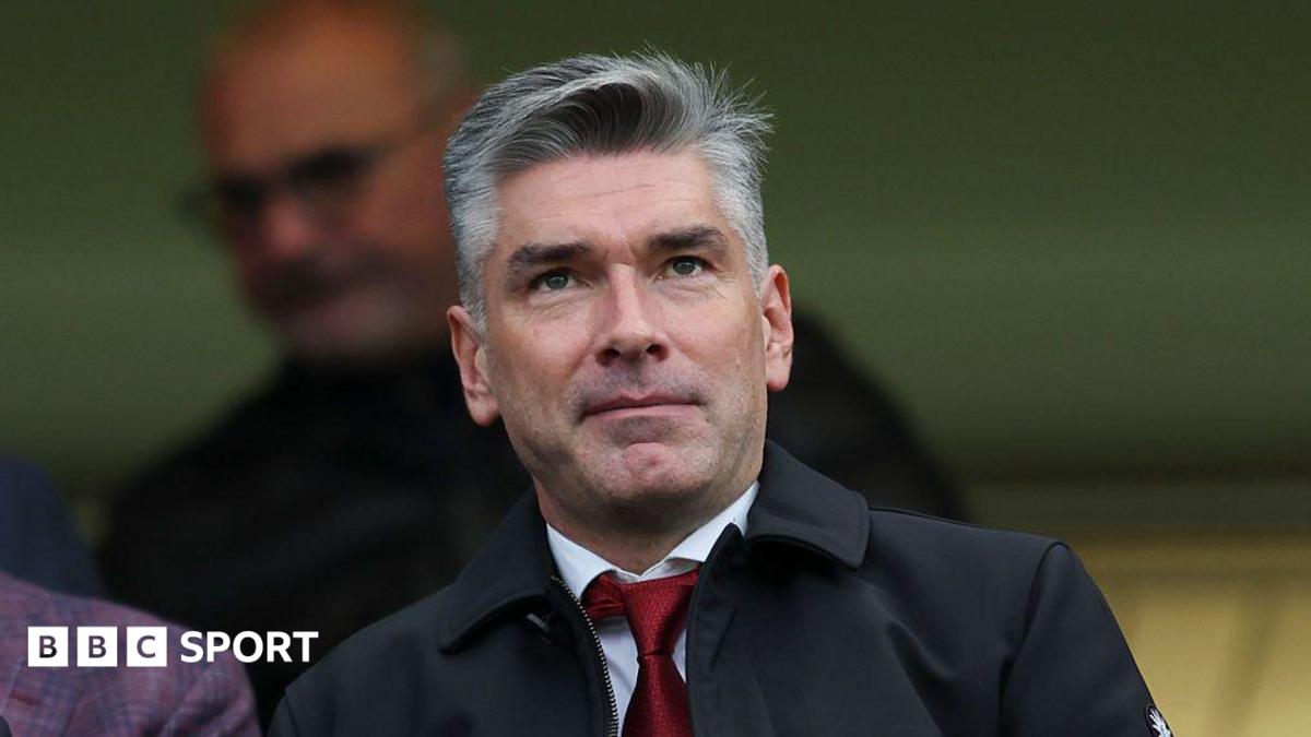 Richard Hughes at a Liverpool game