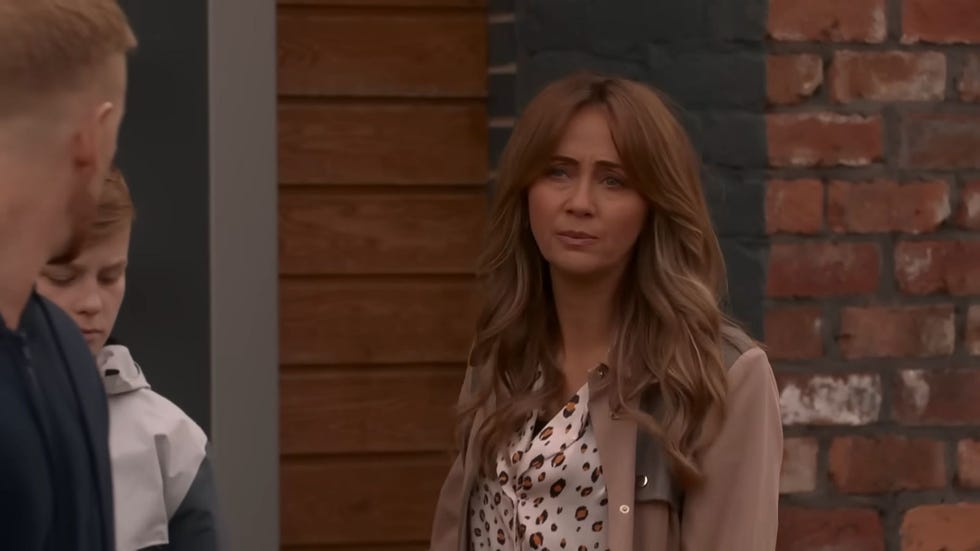 coronation street, maria connor outside in front of a brick wall, giving gary, who is barely in the frame, a disgusted look