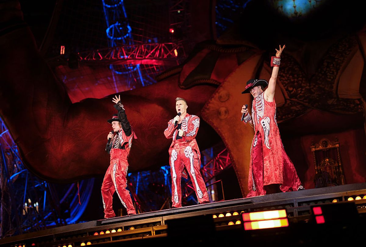 (L-R) Mark Owen, Gary Barlow and Howard Donald of Take That perform live on stage during the "The Circus Live" stadium tour at The London Stadium on June 26, 2026 in London, England