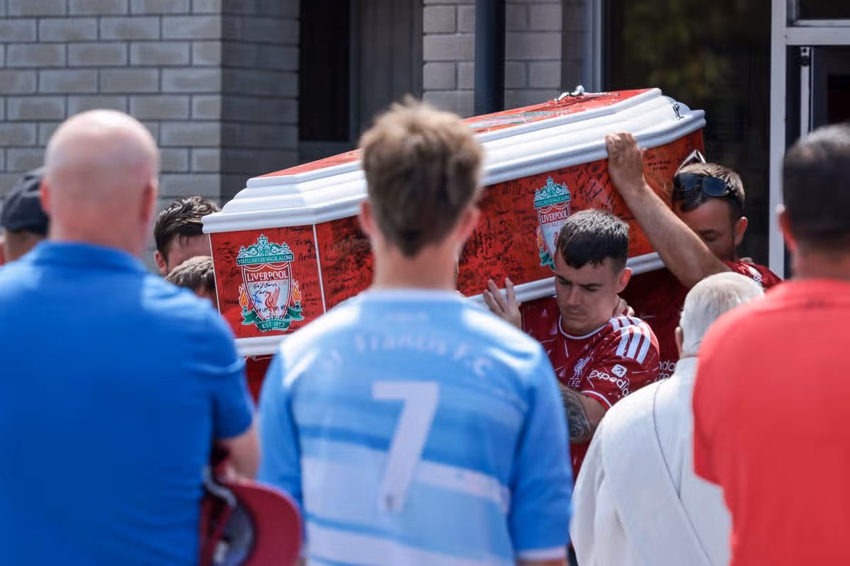 Martin's remains leave church after funeral mass