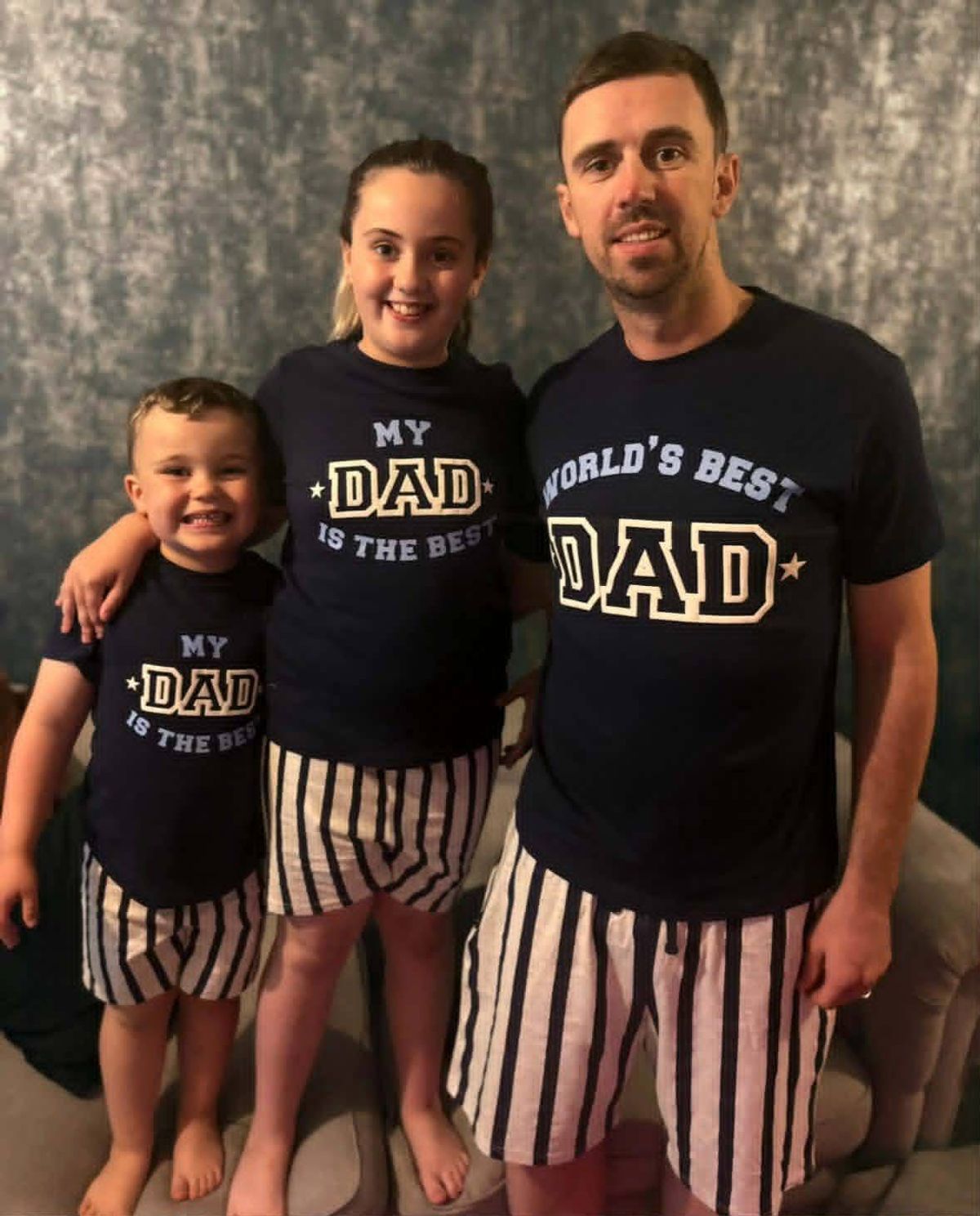 John with two of his three children who he can't bare the thought of leaving behind
