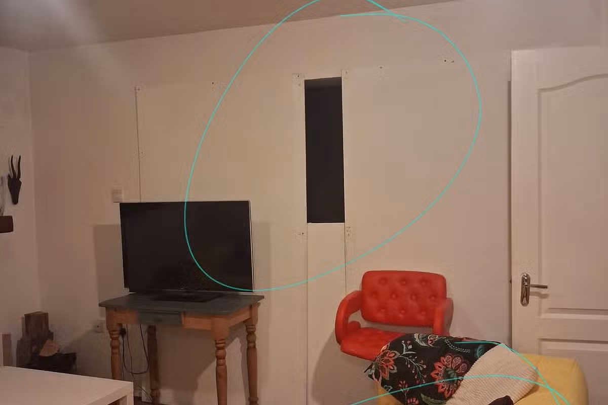 SCARE: Person was behind black space in wall after family removed piece of plasterboard