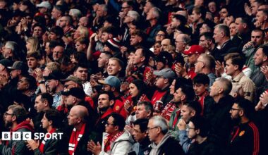 Manchester United fans applaud before kick off of a Premier League fixture against Liverpool