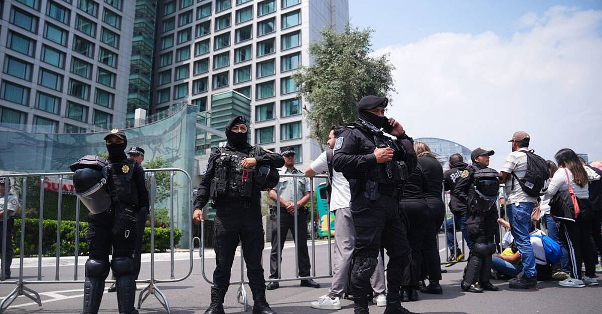 100 riot police guard England hotel as team receive hostile reception in Mexico