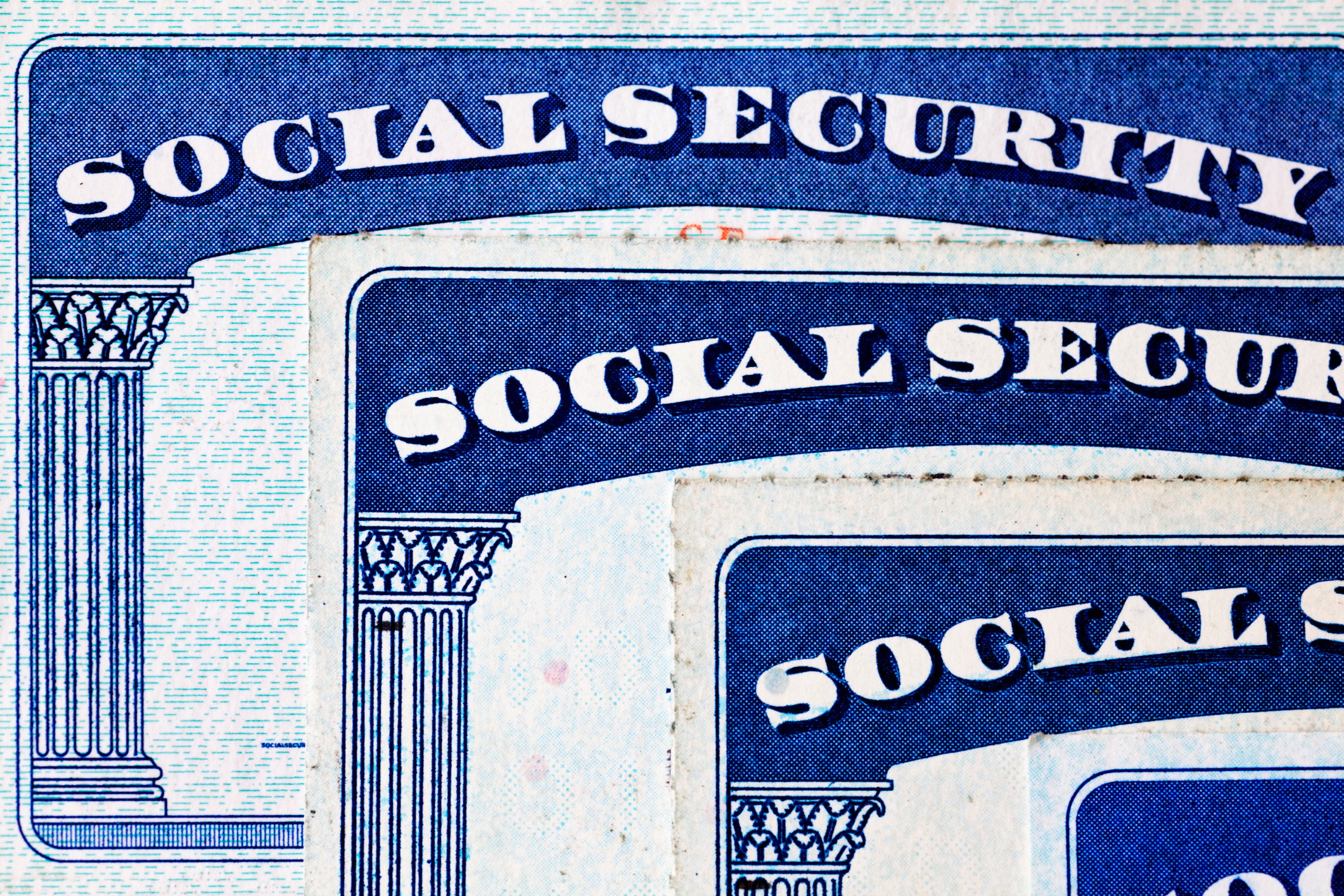 Social Security cards on top of each other.