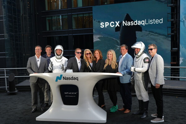 SpaceX executives pose during a closing bell ceremony for the IPO of SpaceX at the Nasdaq MarketSite in New York, Friday, June 12, 2026, in New York. (AP Photo/Frank Franklin II)