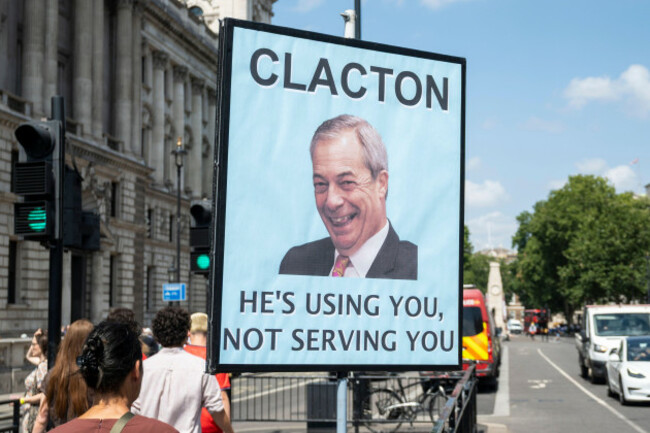 london-uk-15-july-2026-a-sign-put-up-by-anti-brexit-protesters-depicting-reform-leader-nigel-farage-is-seen-opposite-the-houses-of-parliament-in-westminster-it-has-been-reported-that-nigel-fara