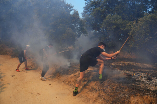 volunteers-try-to-help-stop-a-wildfire-from-advancing-in-san-martin-de-valdeiglesias-west-of-madrid-spain-sunday-july-26-2026-ap-photomanu-fernandez