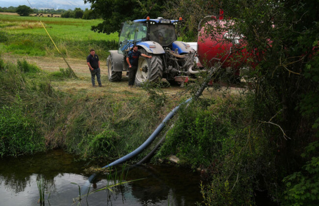 local-farmers-fill-tankers-of-water-from-the-river-anner-for-spreading-at-ground-level-in-an-effort-to-tackle-major-wildfire-as-it-continues-to-burn-at-slievenamon-in-co-tipperary-firefighters-are-sp