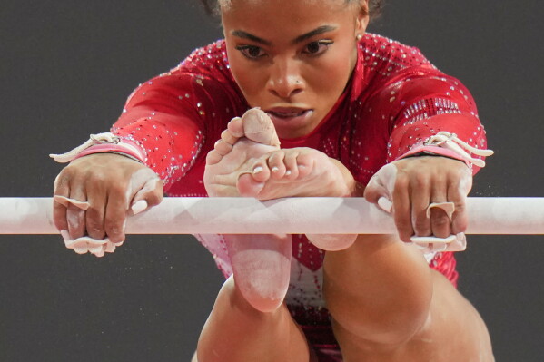 England's Alia Leat competes on the uneven bars during the women's team final and individual qualification of Artistic Gymnastics at the Commonwealth Games in Glasgow, Scotland, Saturday, July 25, 2026. (AP Photo/Kin Cheung)