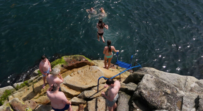 people-cooling-off-at-the-forty-foot-bathing-place-at-sandycove-in-dublin-a-heat-dome-settling-over-western-europe-has-brought-extreme-conditions-across-the-continent-picture-date-wednesday-june