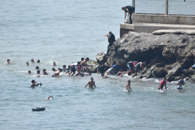 several-people-are-attempting-to-swim-across-the-border-on-30-july-2026-in-ceuta-spain-hundreds-of-people-of-maghreb-origin-have-crossed-into-ceuta-from-morocco-this-morning-either-by-swimming-or