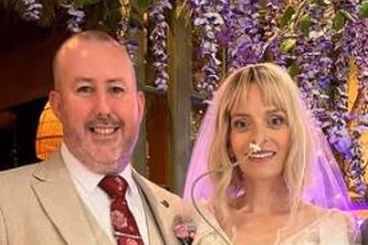 Liz and her husband Kieran on their wedding day