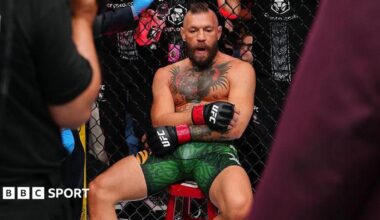 Conor McGregor sits on a stool
