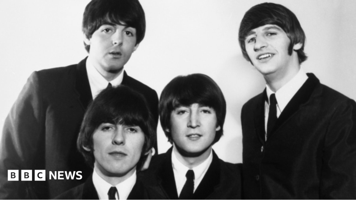 Sounds of Liverpool at the BBC. The Beatles backstage at Top of the Pops. The black and white images features (left to right) Paul McCartney, George Harrison, John Lennon and Ringo Starr in black suits and ties with white shirts and their signature bowl hair cuts.