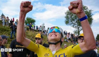 Tadej Pogacar celebrates winning stage 14 of the Tour de France