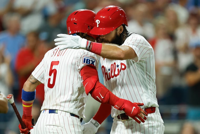Phillies Brandon Marsh celebrates his sixth-inning solo home run with teammate Bryson Stott against the Los Angeles Dodgers.