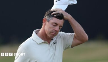 Rory McIlroy cuts a dejected figure as he walks off the 18th green
