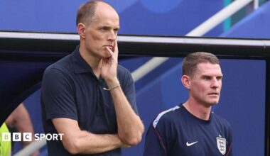 Anthony Barry and Thomas Tuchel watch a match from the stands