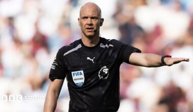 Referee Anthony Taylor holds his arm out during the Premier League match between West Ham United and Leeds United