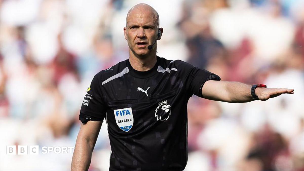 Referee Anthony Taylor holds his arm out during the Premier League match between West Ham United and Leeds United