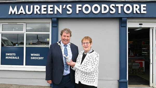 Maureen Kenny with the Cathaoirleach of Roscommon County Council, Cllr Dominick Connolly, as she retires from the shop she has run in Ballyforan, Maureen's Foostore, for the past 57 years. Pic: Gerard O'Loughlin