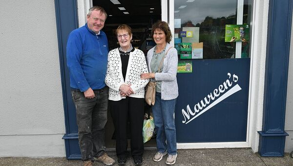 Maureen Kenny with Aidan Thompson and Breege Mullen as she retires from the shop she has run in Ballyforan, Maureen's Foostore, for the past 57 years. Pic: Gerard O'Loughlin