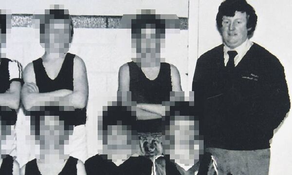 Bill Kenneally with a young basketball team in 1984