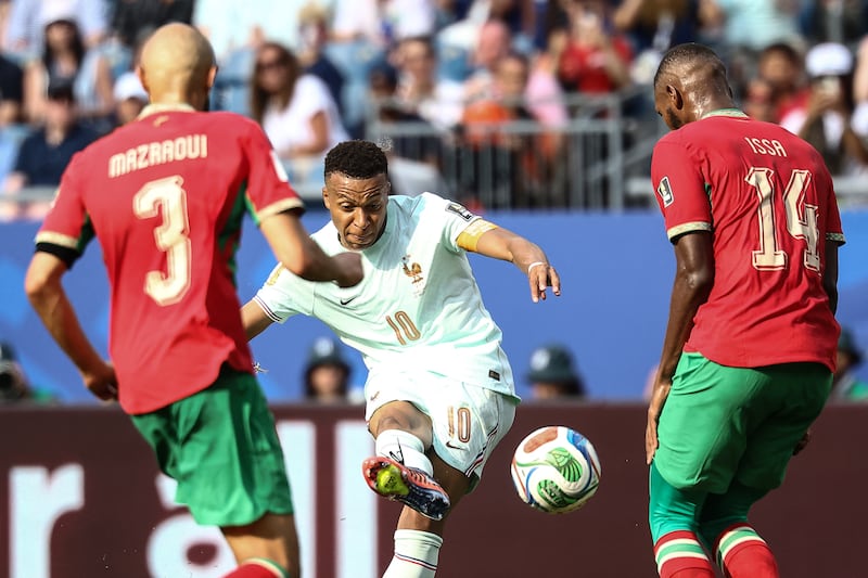 Kylian Mbappé scores the opening goal for France. Photograph: Charly Triballeau/AFP via Getty Images