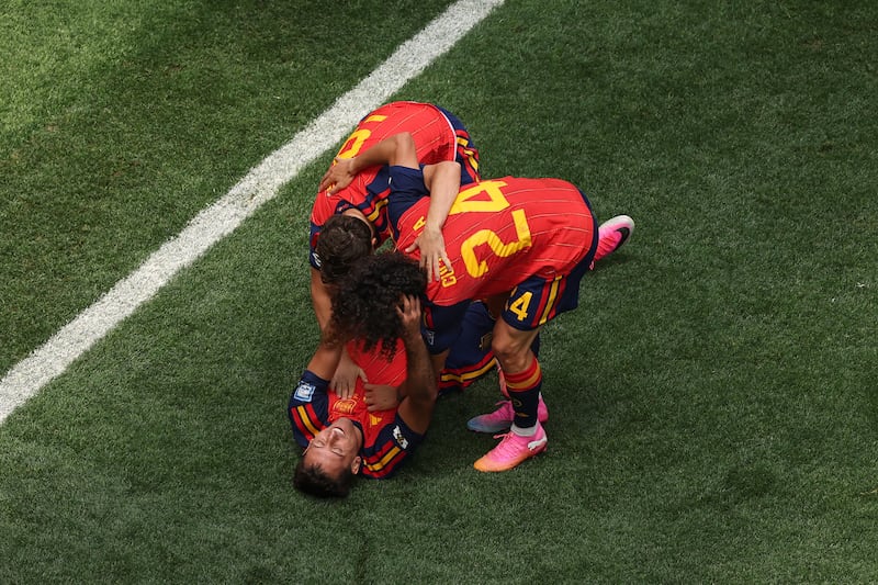 Mikel Oyarzabal falls to the ground in celebration of his second goal as Spain ease past Austria in the World Cup Round of 32. Photograph: Charlotte Wilson/Getty Images