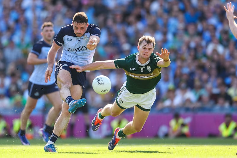 Dublin's Brian Howard scores a point despite the efforts of Kerry's Mark O’Shea. Photograph: James Crombie/Inpho