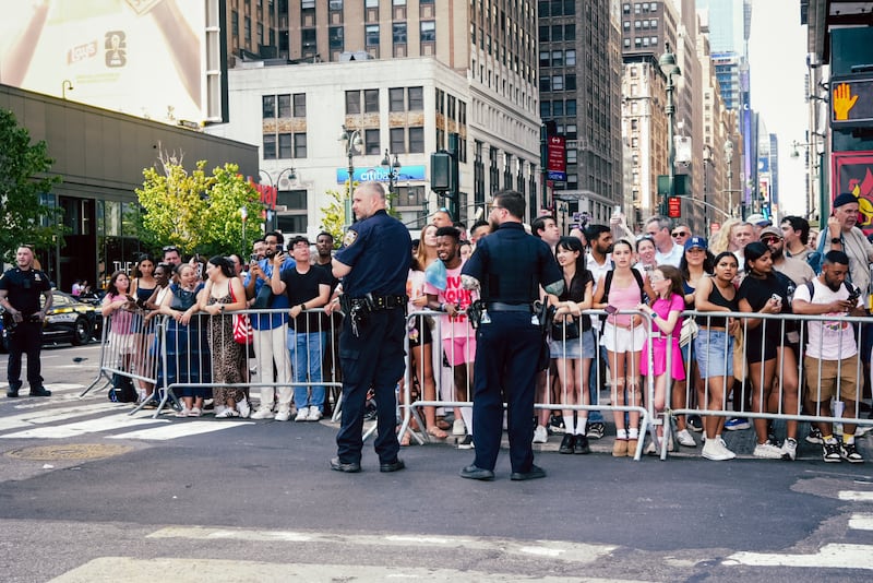 New York police officers stand watch outside of Madison Square Garden as guests arrive. Photograph: Jutharat Pinyodoonyachet/The New York Times
                      
