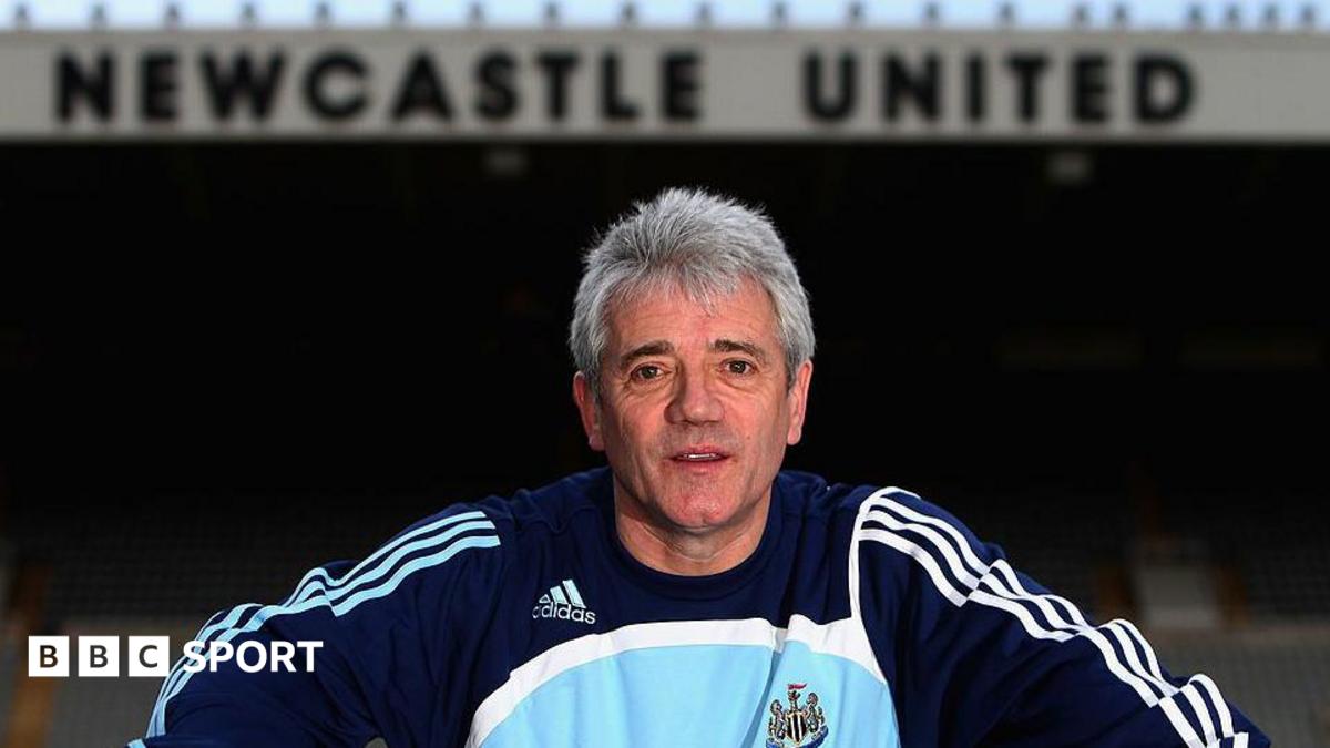 Kevin Keegan posing for a photo inside St James' Park, with the Newcastle United lettering on the East Stand behind him