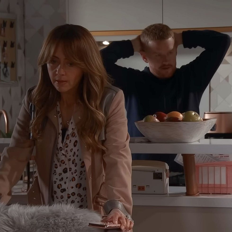 coronation street, maria and gary in the kitchen, maria looks away from gary in disgust while he has his head in his hands