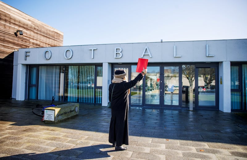 A woman makes her view known during a protest against the scheduled Ireland-Israel matches, at FAI headquarters in February. Photograph: Tom Maher/Inpho