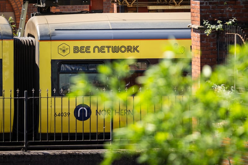 A 'Bee Network' train in Manchester. Photograph:  James Speakman/PA Wire