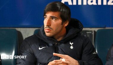 Sandro Tonali looking off to the left on the bench for Spurs during pre-season
