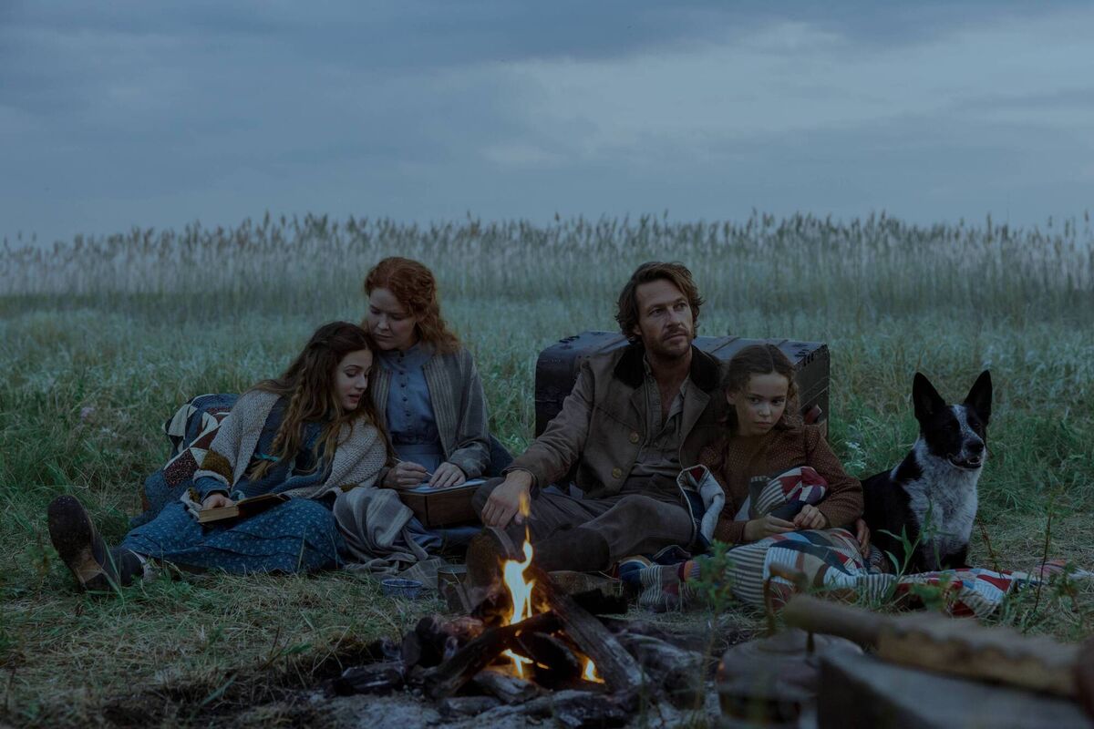 (Left to right) Skywalker Hughes as Mary Ingalls, Crosby Fitzgerald as Caroline Ingalls, Luke Bracey as Charles Ingalls, and Alice Halsey as Laura Ingalls in episode 101 of Little House on the Prairie. Photo: Eric Zachanowich/Netflix © 2026